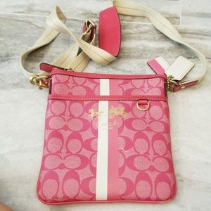 Pink and white Coach crossbody purse